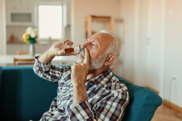 istock Senior Man With Nasal Spray 1186595255