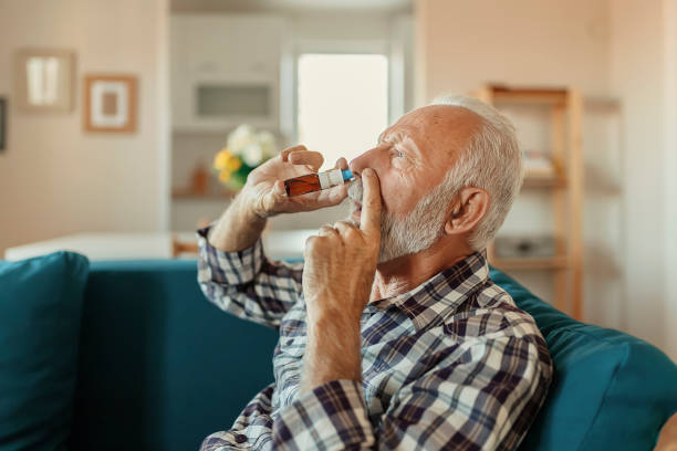 istock Senior Man With Nasal Spray 1186595257