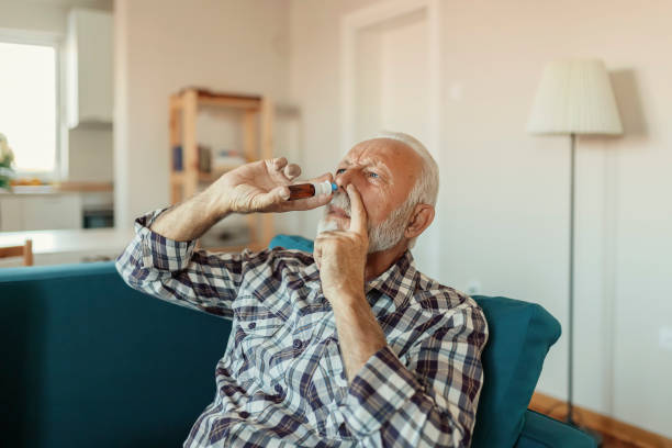 istock Senior Man With Nasal Spray 1186595260