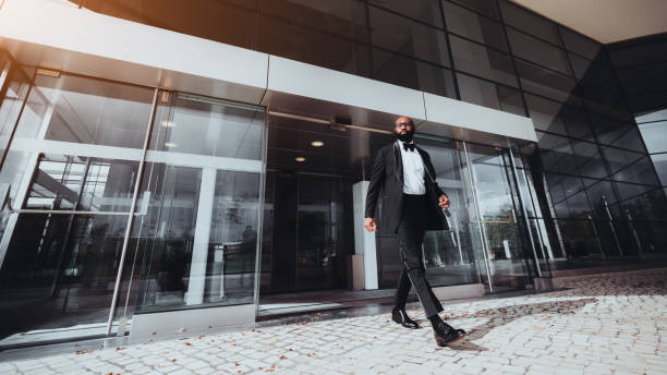 istock A black fancy guy leaving a building 1186599527