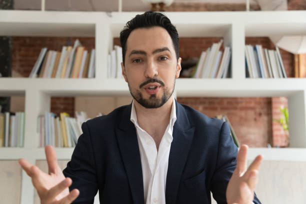 istock Middle east appearance businessman makes videocall look at camera talking 1186603898