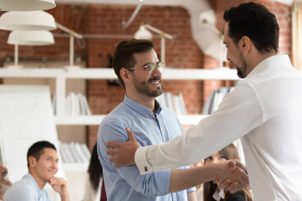 istock Middle east appearance boss praising employee express respect shaking hands 1186603916