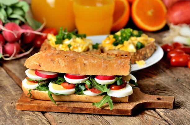 istock Baguette sandwich with egg, arugula salad, tomatoes and radish 1186604012