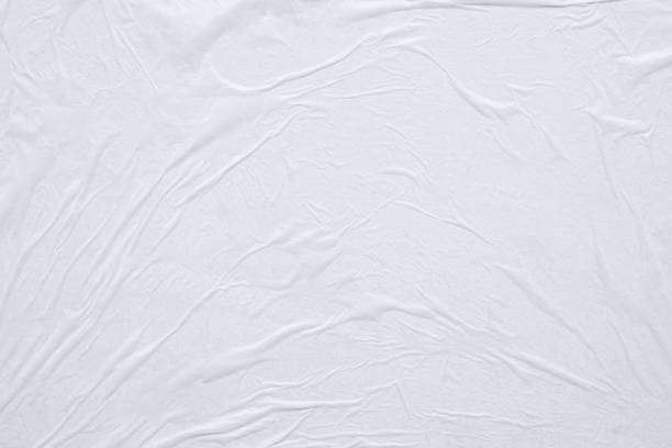 istock Blank white crumpled and creased paper poster texture background 1186604208