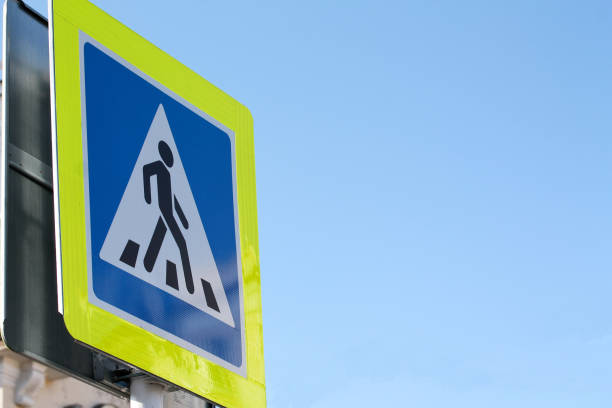 istock Pedestrian crossing blue sign with yellow light-reflecting frame 1186608846