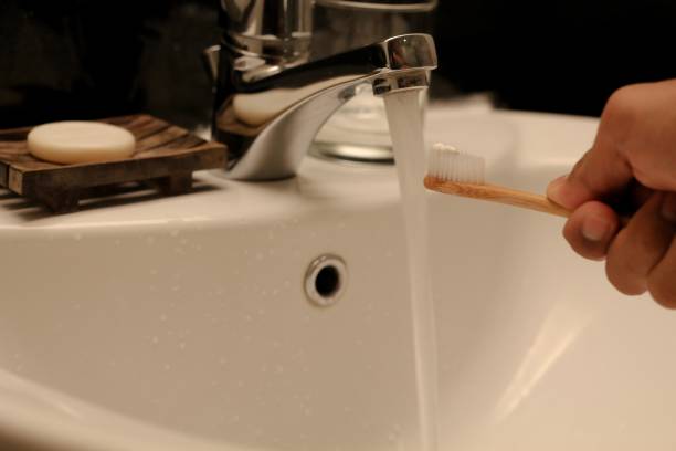 A men ready to brushing his teeth with bamboo teeth brush