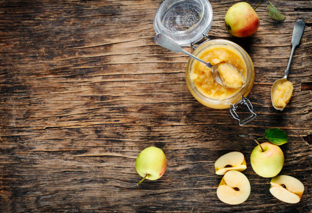 istock Apple sauce in jars on wooden rustic background, top view, copy space 1186616094