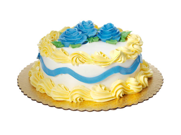 istock Cake with white icing and yellow decoration 1186622066