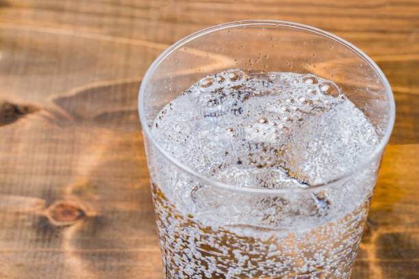 istock Carbonated water on wood grain background 1186624421