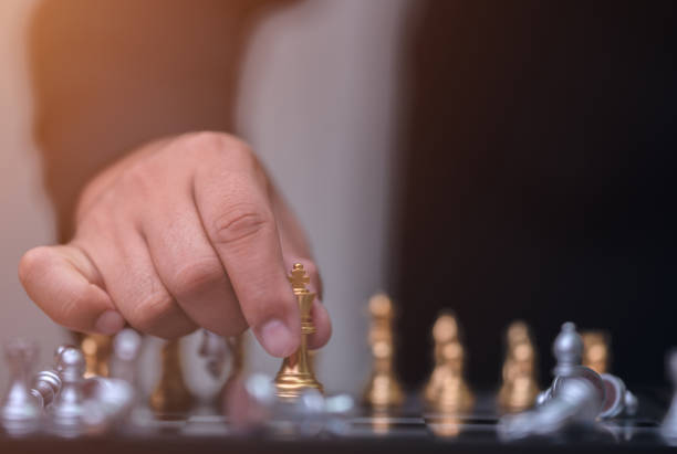 istock Business man holding golden king chess 1186624558
