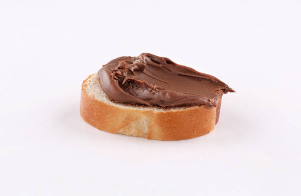 istock spread chocolate on toasted slice of baguette 1186632201