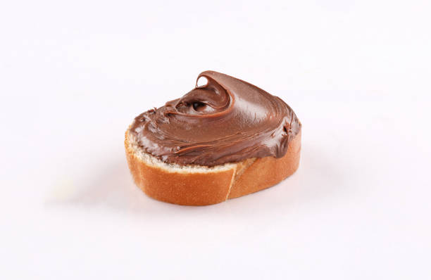 istock spread chocolate on toasted slice of baguette 1186632203