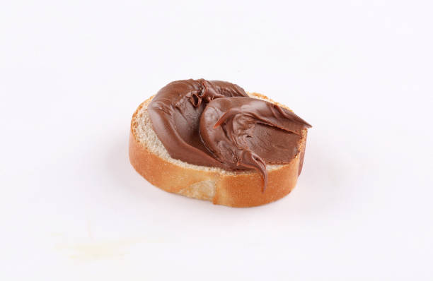 istock spread chocolate on toasted slice of baguette 1186632208