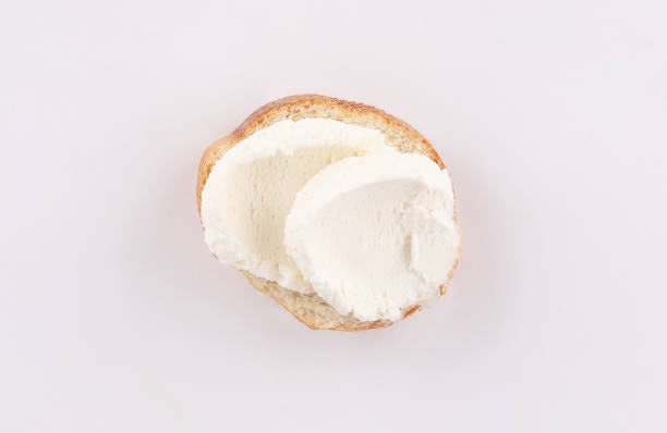 istock spread cheese on slices of baguette 1186632230