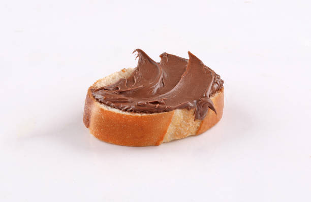istock spread chocolate on toasted slice of baguette 1186632273