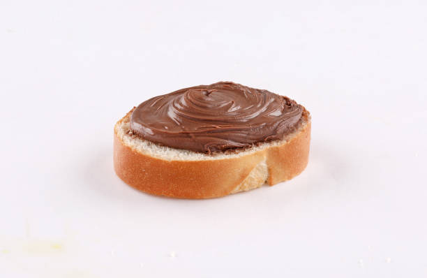 istock spread chocolate on toasted slice of baguette 1186632282