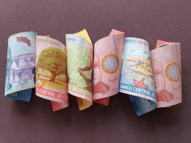 istock Costa Rican banknotes of different denominations and brown background 1186635220