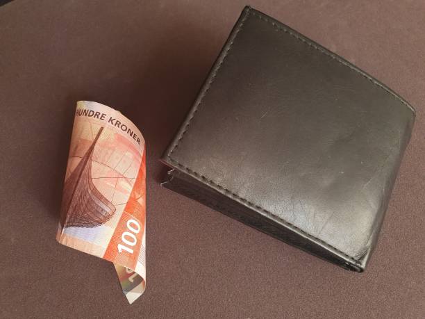 black leather wallet and norwegian banknote of 100 kroner - norwegian coin imagens e fotografias de stock