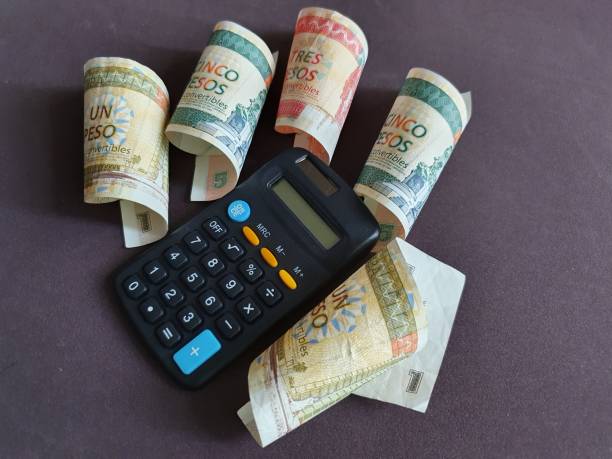 istock calculator and cuban banknotes of different denominations 1186639141