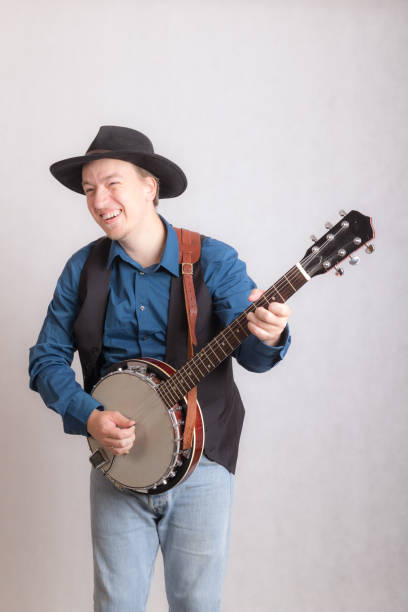 istock cheerful musician with banjo 1186641757