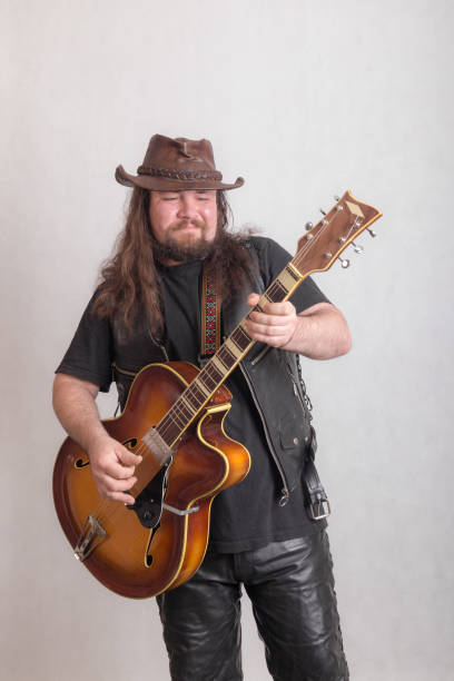 istock musician playing a guitar 1186641758