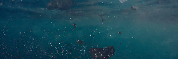 istock plastic pollution in ocean water, microplastics in the current 1186642170