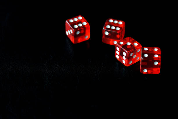 istock Red dice on a black background close-up. Gambling oncept 1186642791