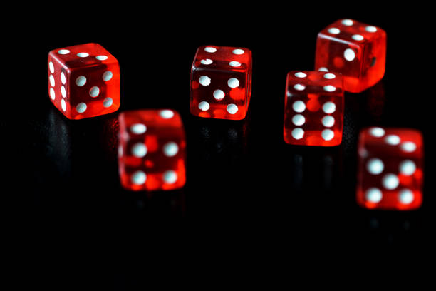 istock Red dice on a black background close-up. Gambling oncept 1186642801
