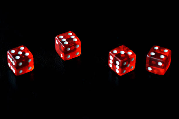 istock Red dice on a black background close-up. Gambling oncept 1186642803