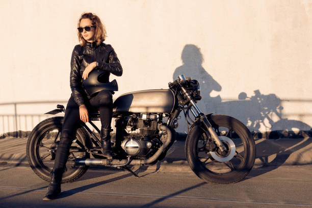 istock Biker girl on caferacer motorcycle. 1186643773