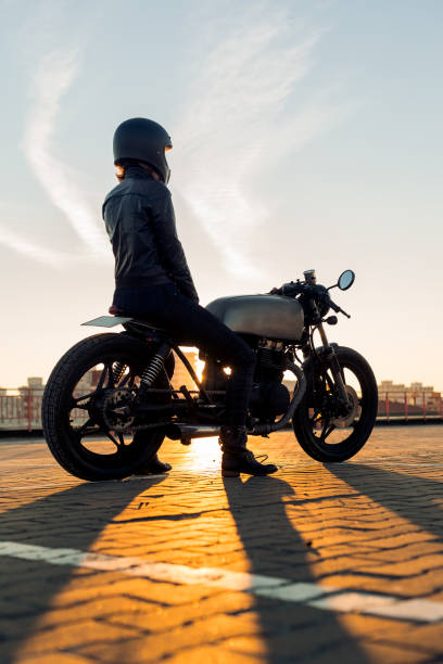 istock Biker girl on caferacer motorcycle. 1186643936
