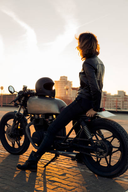 istock Biker girl on caferacer motorcycle. 1186643956