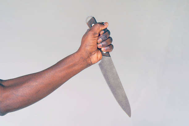istock Kitchen knife in a hand. Big kitchen knife in man hand. 1186644954