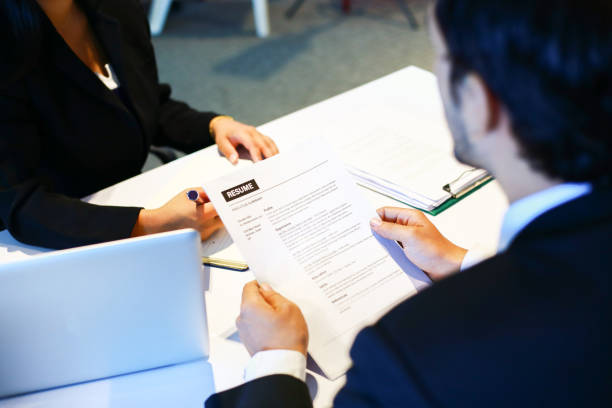 istock Job interview in office, focus on resume, close up view 1186645963