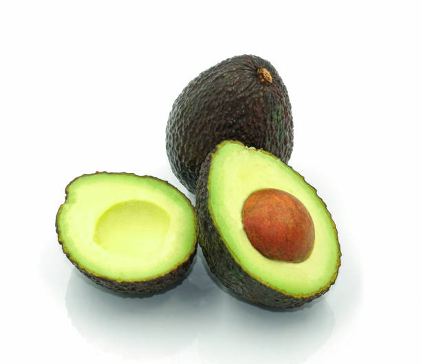 istock group of fresh avocado fruit cut half for eat. Isolated on white background 1186651578