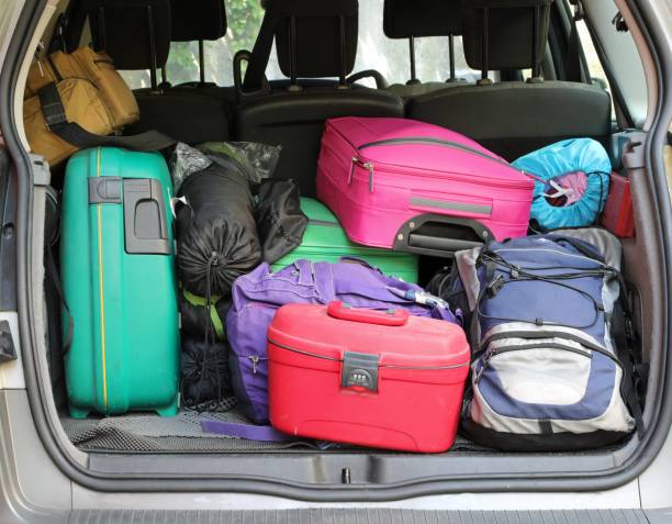 istock car trunk with many suitcases for the holidays 1186656282