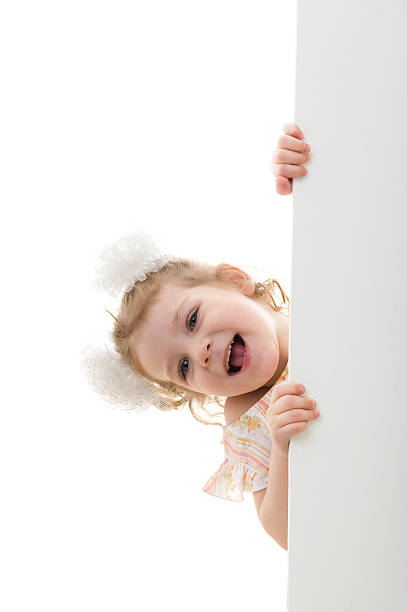 istock Little girl holding a white board 118665864