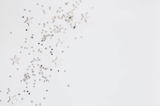 Christmas composition. Christmas silver decorations on white background. Flat lay, top view, copy space