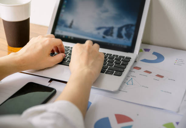 istock Business hand to computer Human work in the office on the desk 1186661615