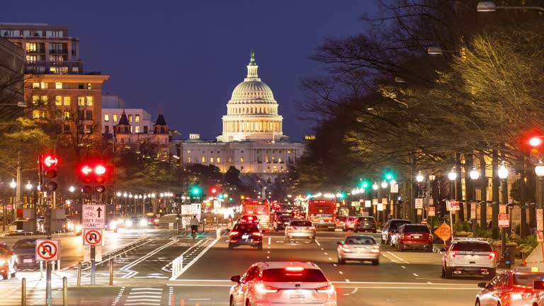 Time-lapse: US Capitol Building with transportation light from Freedom Square in Washington DC, USA at sunset twilight