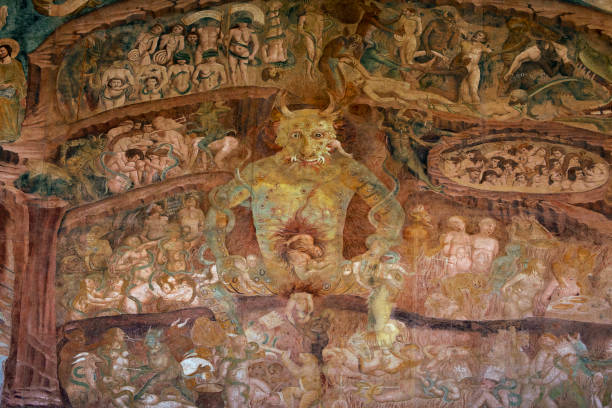 Part of frescoes "Triumph of Death", last Judgement by Buonamico Buffalmacco in years 1336-1341, renovated fresco inside the Campo Santo cemetery. , Pisa Italy, Camposanto monumentale. Medieval vision of hell, big devil inside the hell, torments of hell, mural inside the Camposanto cemetery of the Campo dei Miracoli, Pisa, Tuscany, Italy. Christian fresco on the wall of Monumental Cemetery. medieval fresco stock pictures, royalty-free photos & images
