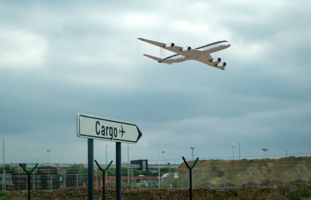 istock Air cargo sign on ground and a cargo flight on the air 1186669382