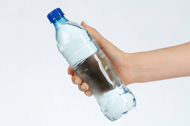 istock Woman hold plastic bottle with water 1186673011