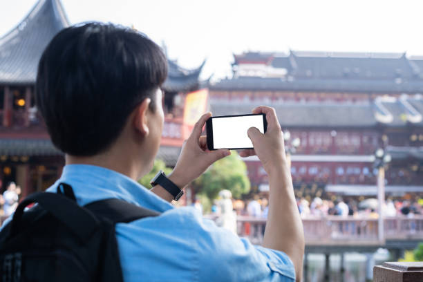 istock young asian man with mobile phone 1186673230