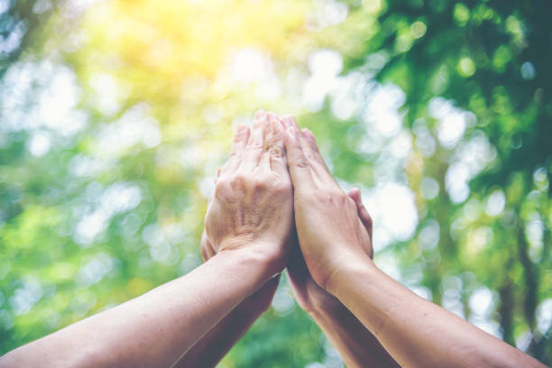 istock People hands assemble as a connection meeting teamwork concept. Group of people assembly hands as business or work achievement. Man and women touch each other hands outdoor. Teamwork conceptual. 1186673442