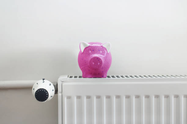 istock Piggy bank  on the radiator 1186673531