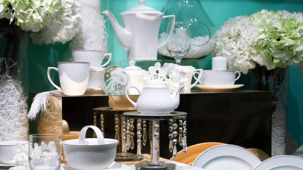 istock Details and decoration elements of table setting, festive dinner decoration in a restaurant for celebration. Elegant porcelain ceramic dishes, beautiful original plates, tea cups at the showcase store 1186673748