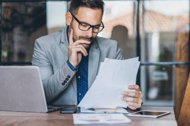 istock Young businessman working at office 1186675177