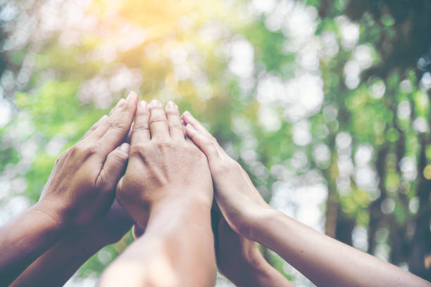 istock People hands assemble as a connection meeting teamwork concept. Group of people assembly hands as business or work achievement. Man and women touch each other hands outdoor. Teamwork conceptual. 1186676051