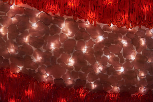 istock The surface is made of embossed red and brown glass, which is illuminated from the inside by LED lamps. Background 1186676052